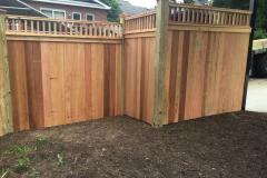#24 Cedar Solid Board Fence with 2x2 Topper Stepped