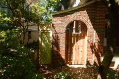#22 Cedar Spaced Gate on Brick Wall
